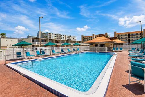 2 outdoor pools, open 9:00 AM to 10:00 PM, pool umbrellas, pool loungers