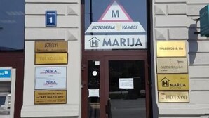 A building with a sign for 'TULKOJUMI' indicating a notary and legal office. - Nika Apart Hotel  (Riga)