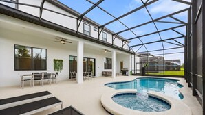 A pool area with a glass ceiling, lounge chairs, and a hot tub. - Last Minute Disney Getaway! Luxury Villa with Private Pool, Hot Tub & Themed Bedrooms. Book Now! #147189 (Orlando)