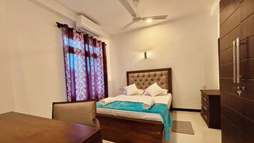 Deluxe Double Room, Garden View | In-room safe, desk, laptop workspace, iron/ironing board