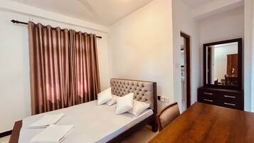 Economy Double Room, Garden View | In-room safe, desk, laptop workspace, iron/ironing board