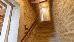 A stone staircase with wooden handrails leading to a door at the top. - Cyrano & Roxane - 1 km de la plage (Ver-sur-Mer)