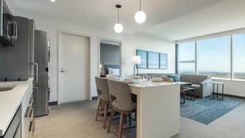 Suite, 1 Bedroom (Washer/Dryer) | Living area | 55-inch Smart TV with cable channels, Netflix, streaming services