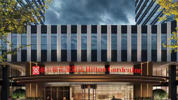 The exterior of the Hilton Garden Inn with a modern facade, large windows, and a prominent entrance. - Hilton Garden Inn Lianyungang Free Trade Zone Lipp (Lianyungang)