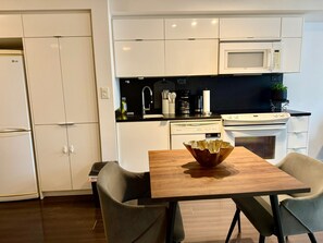Classic Condo, City View | Private kitchen | Fridge, microwave, cleaning supplies, paper towels - Waterfront Grand Apartments (Toronto)