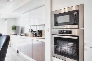 Exclusive Condo, Lake View | Private kitchen | Fridge, microwave, cleaning supplies, paper towels - Waterfront Grand Apartments (Toronto)