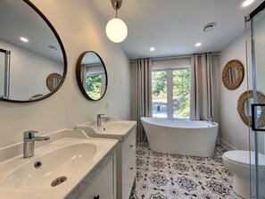 Bathroom with bathtub and shower
