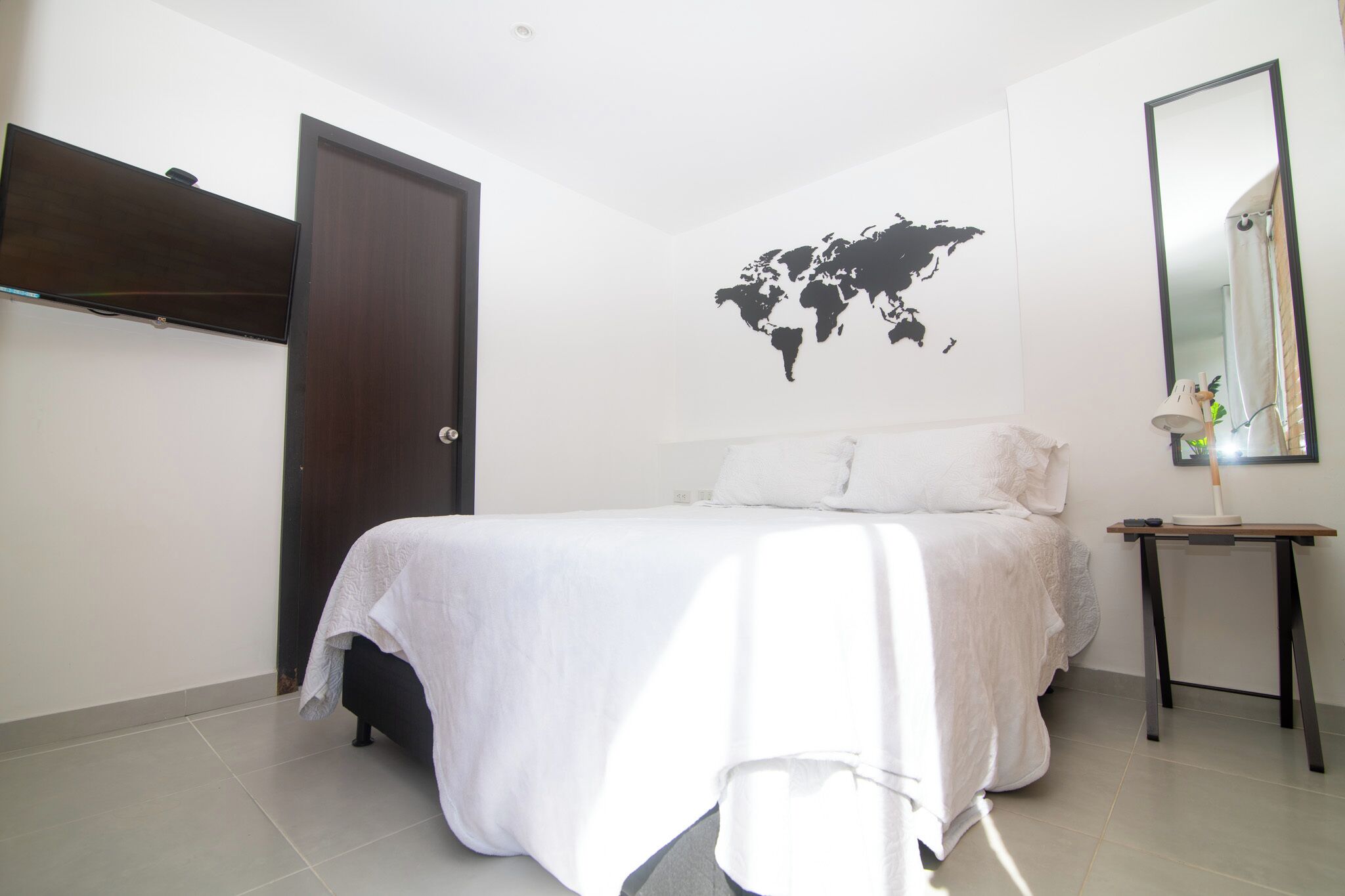 Apartment, Kitchenette, City View | Desk, laptop workspace, blackout curtains, iron/ironing board