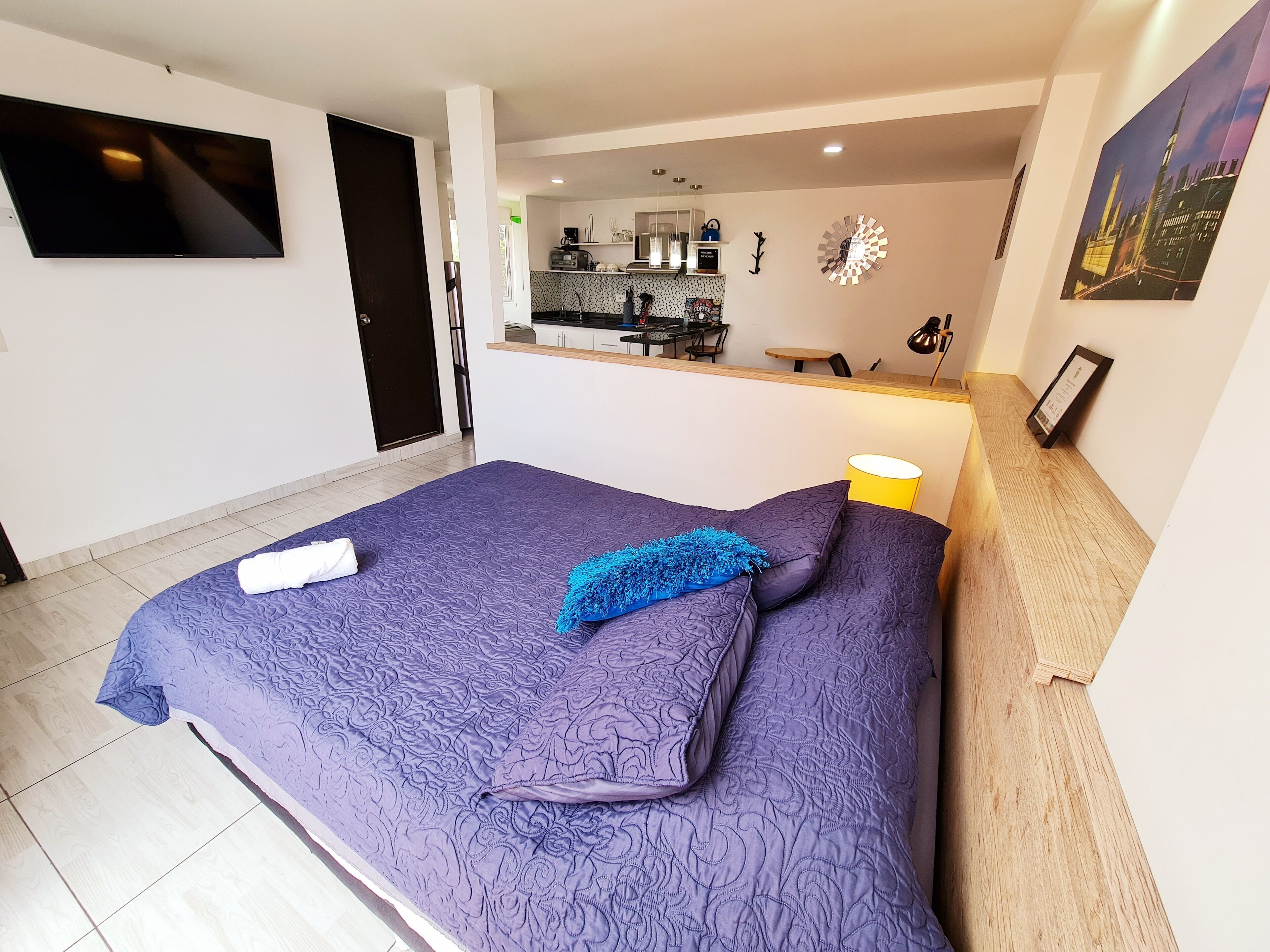 Apartment, 1 Bedroom, City View | Desk, laptop workspace, blackout curtains, iron/ironing board