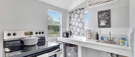 Microwave, coffee/tea maker, toaster, cookware/dishes/utensils