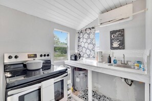 Microwave, coffee/tea maker, toaster, cookware/dishes/utensils