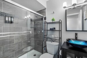 Shower, hair dryer, towels, shampoo