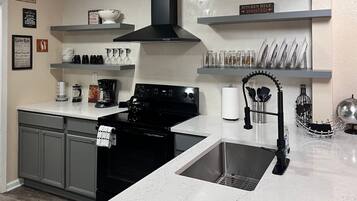 Fridge, microwave, stovetop, coffee/tea maker