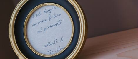 A framed quote on a shelf.