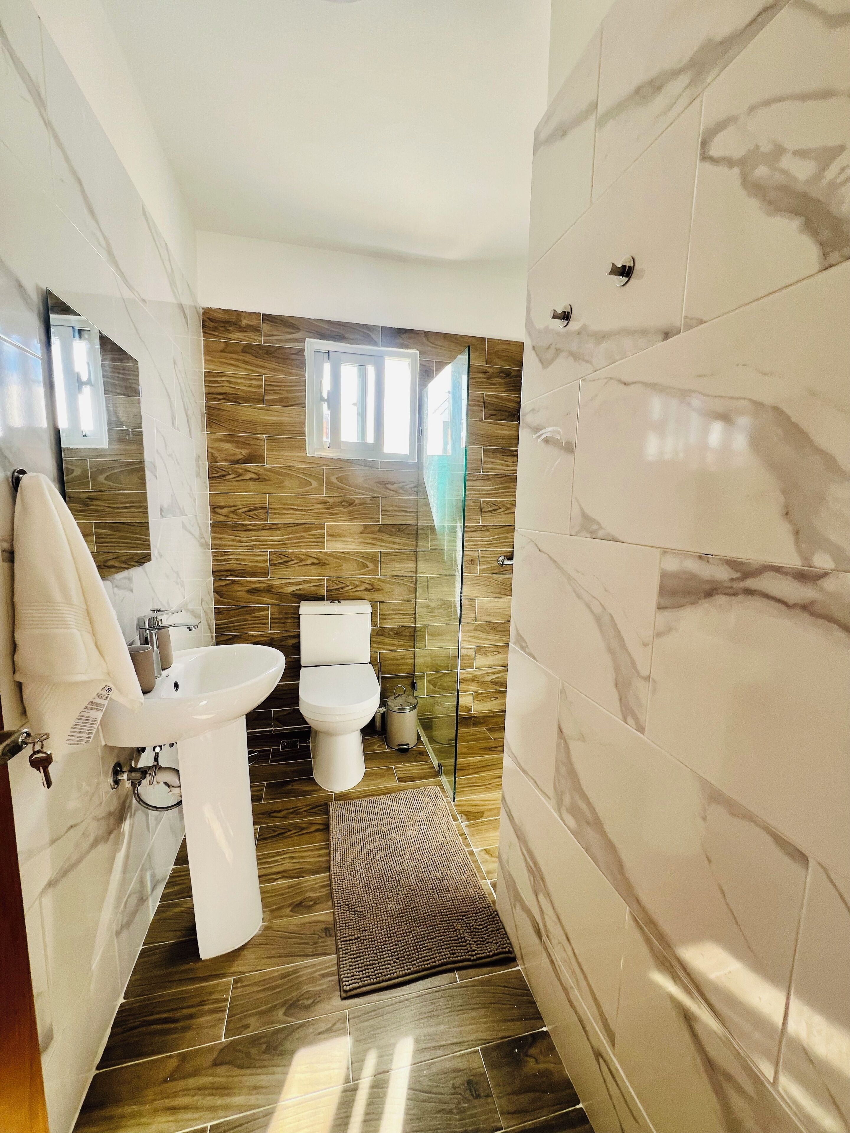 Shower, hair dryer, towels, soap