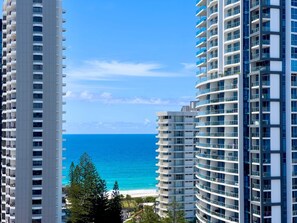 A high-rise building with multiple balconies overlooking a beach. - The Enderley Escape Lv15 (Surfers Paradise)