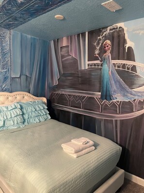 A bedroom with a bed, a mural of a character, and a window with curtains. - Welcoming 5-bed 5 bath house close to Disney Universal sleeps 13+ with Pool heat (Four Corners)