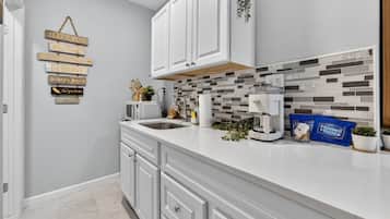 Fridge, microwave, stovetop, coffee/tea maker