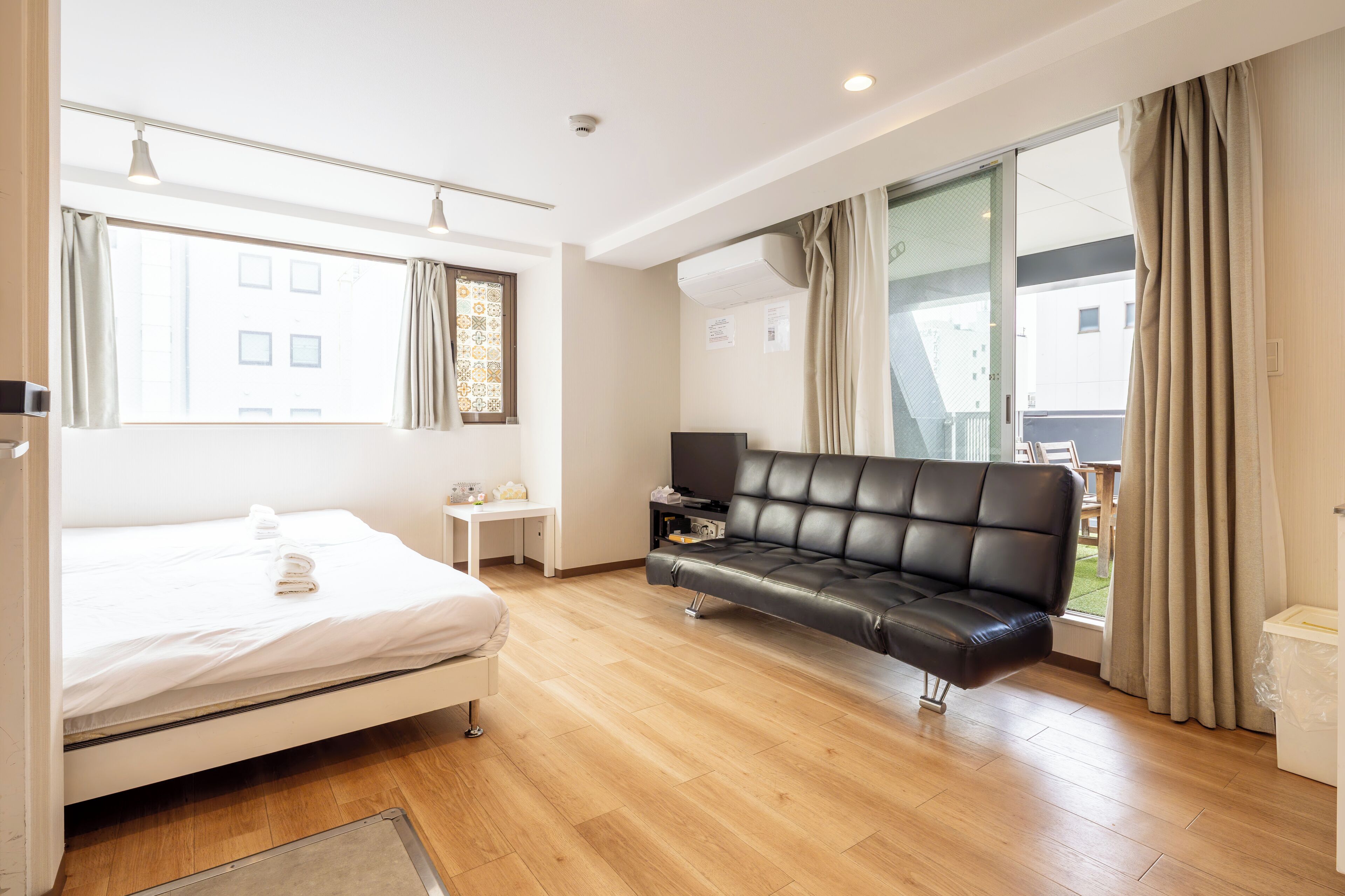 Standard Quadruple Room, Balcony, City View | Desk, laptop workspace, blackout drapes, iron/ironing board