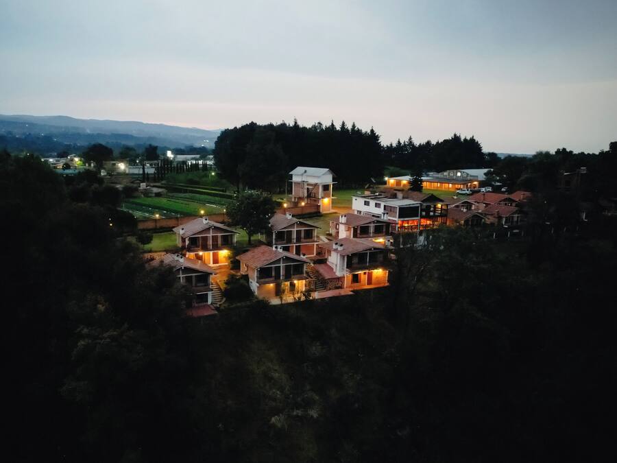 A residential area with houses, some with visible balconies and a few with attached garages.