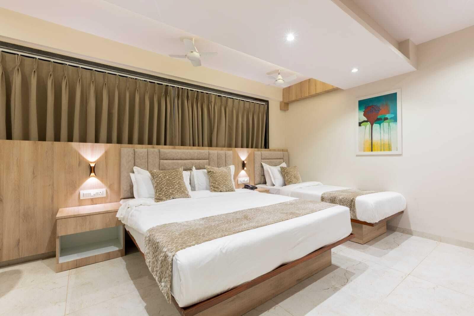 Deluxe Triple Room, City View | Desk, laptop workspace, soundproofing, free WiFi