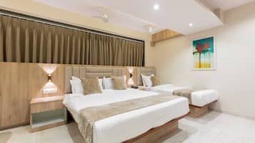 Deluxe Triple Room, City View | Desk, laptop workspace, soundproofing, free WiFi