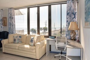 TV, books - Oceanfront Condo with Stunning Sunrise Views (Flagler Beach)