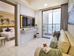 Apartment, 3 Bedrooms, City View | Living area | 43-inch Smart TV with cable channels - By The Bay By SanLiving - 3BR - PIK (Jakarta)