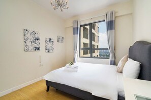 Deluxe Apartment, 1 Bedroom, City View | Premium bedding, Select Comfort beds, free minibar items, in-room safe - MASTERI Premier Residence (Thao Dien)
