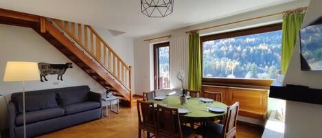 Apartment, Balcony, Mountain View | Living area | 23-inch Smart TV with cable channels