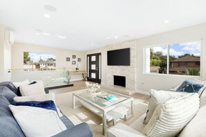 Smart TV, fireplace - Sleek Designer Home + Courtyard + Walk to Beach + Dining | Seal Beach Escape (Seal Beach)