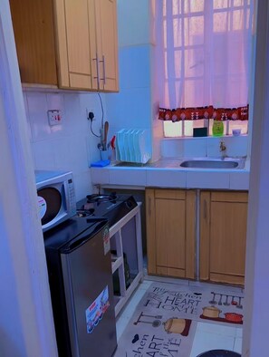 Private kitchen - Stylish 1BR retreat in TRM Drive, Nairobi with modern comfort and serene vibes. (Nairobi)