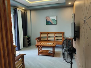 Comfort Condo, 1 Bedroom, Mountain View | Living room | 43-inch Smart TV with digital channels - MEEK'S VILLAS TRANSIENT HOUSE (Baguio)