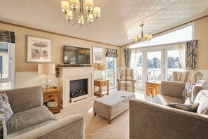 TV, fireplace, offices - Host & Stay | Lakeside Gem Lodge (Pocklington)