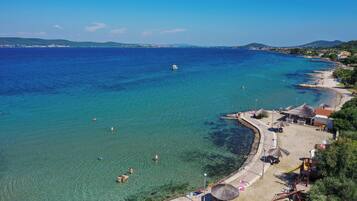 On the beach, white sand, 2 beach bars