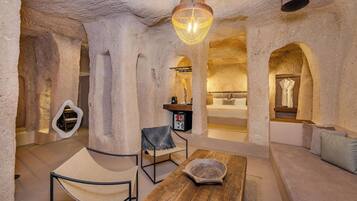 Dungeon Cave Suite with Private Pool | Living area | Heated floors, printers