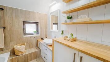 Deluxe Suite, Lake View | Bathroom | Shower, hair dryer, towels, toilet paper