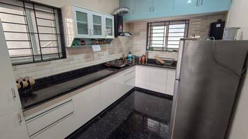 Fridge, stovetop, electric kettle, cookware/dishes/utensils