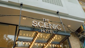 The exterior of The Scenic Hotel with a marquee sign and string lights. - The Scenic Hotel  (Phnom Penh)