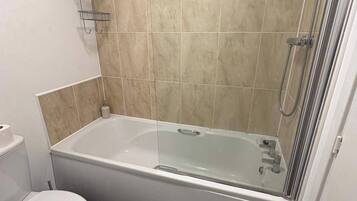 Combined shower/bathtub, deep-soaking bathtub, hair dryer, towels