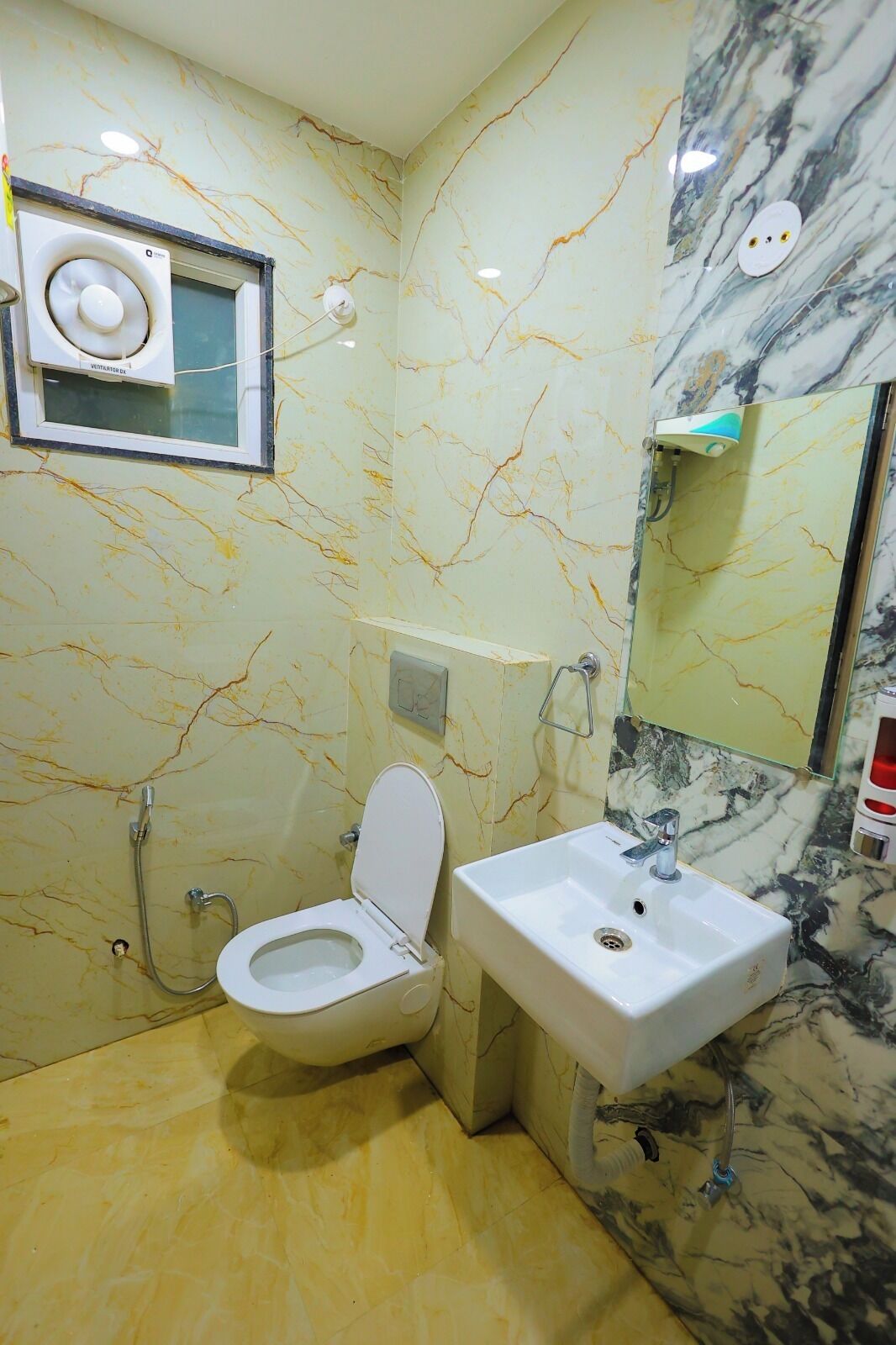 A bathroom with a toilet, sink, and shower.