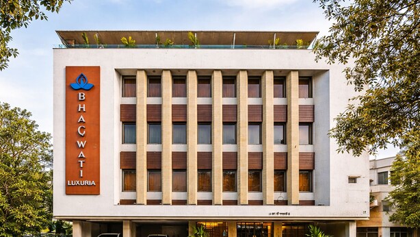 A modern building with a sign reading 'BHACWATI LUXURIA.' - Bhagwati Luxuria Hotel  (Indore)