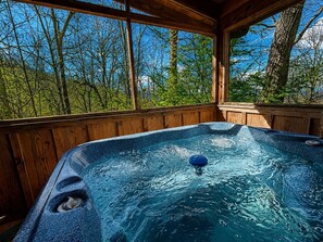 A hot tub with a view of trees and sky. - Peaceful 2BR w/Hot Tub*Pool Table*Fireplace*Arcade (Sevierville)