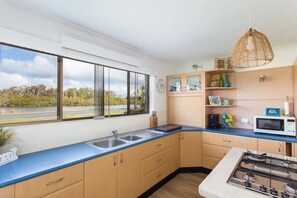 Fridge, microwave, oven, stovetop - Waterfront Holiday Home in Tuncurry (Tuncurry)