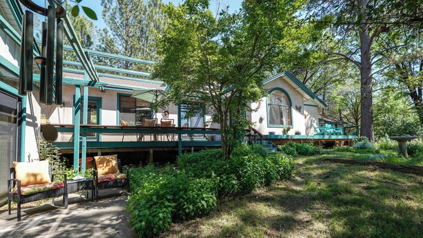 A house with a covered porch, outdoor seating, and a garden. - On 10 Acres! Serene Nevada City Retreat w/ Hot Tub (Nevada City)