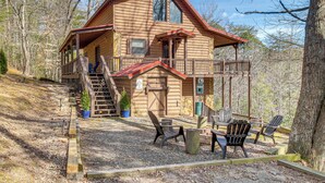 A log cabin with a balcony, outdoor seating, and a staircase leading to the main entrance. - Hot Tub + Mtn Views: Peaceful Blue Ridge Retreat! (Blue Ridge)