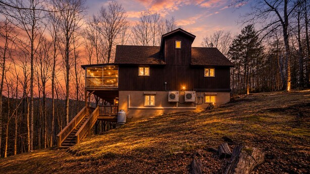 A two-story house with a balcony, a staircase, and a large window. - Smore than enough! Powder Horn Mountain - 3K,2 twin bunks, Pets OK,Pool table (Deep Gap)