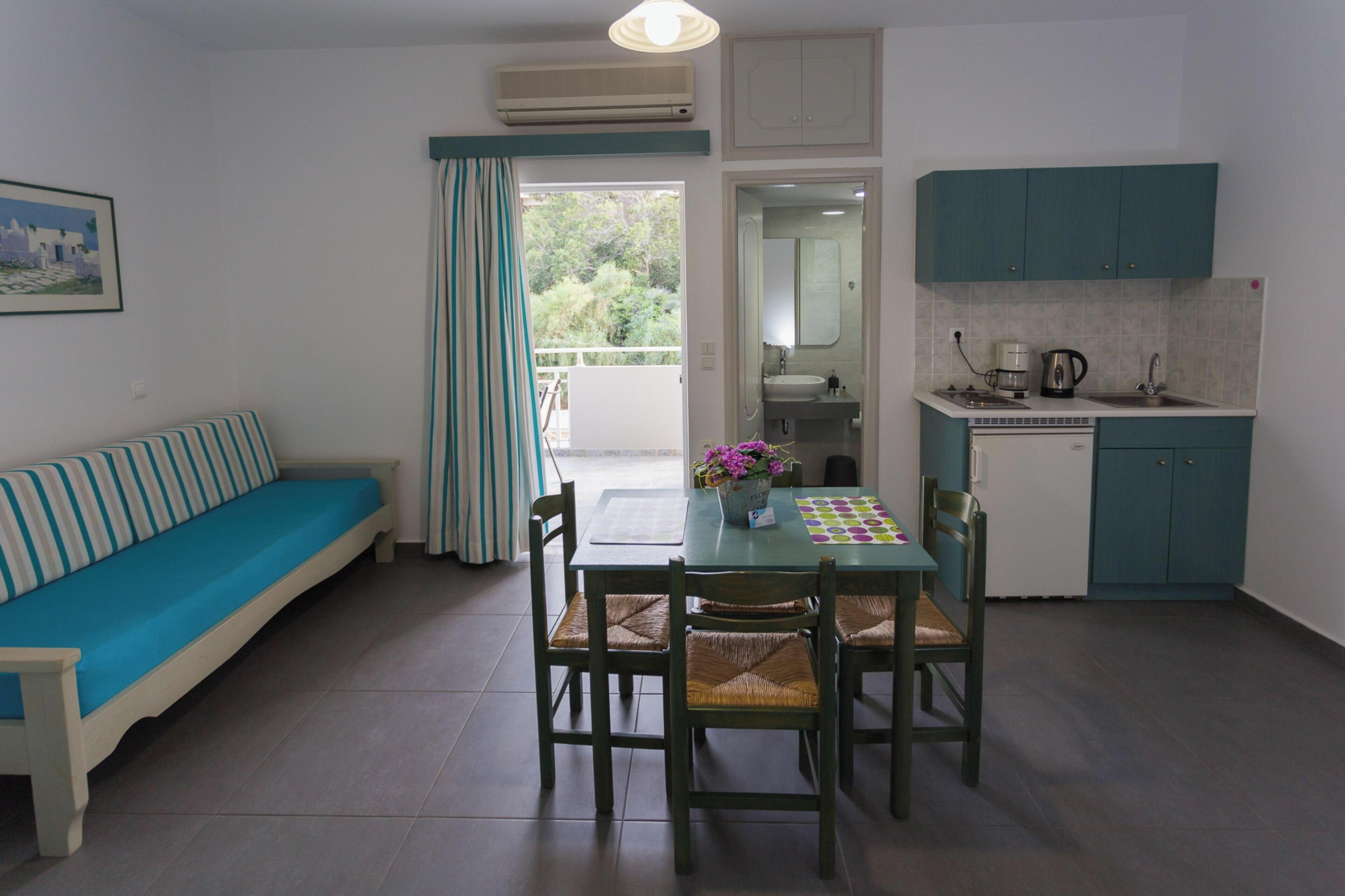 Apartment, 1 Bedroom, Sea View | Living area | 27-inch LCD TV with cable channels