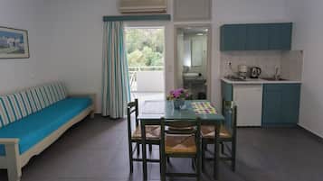 Apartment, 1 Bedroom, Sea View | Living area | 27-inch LCD TV with cable channels