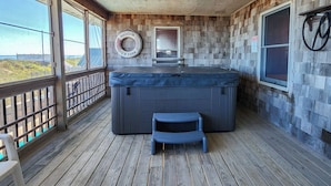 A wooden deck with a hot tub, a step stool, and a view of the beach. - Captain's R&R - 5 BR Oceanfront Home w/Private Pool & Hot Tub - Dogs Allowed (Southern Shores)